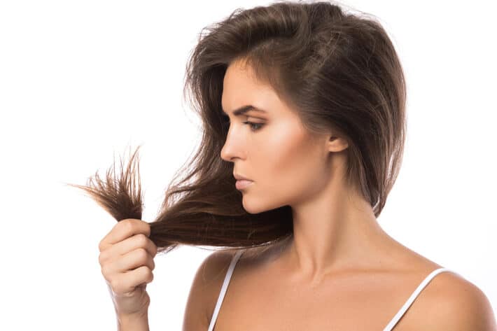 unhappy woman with damage hair